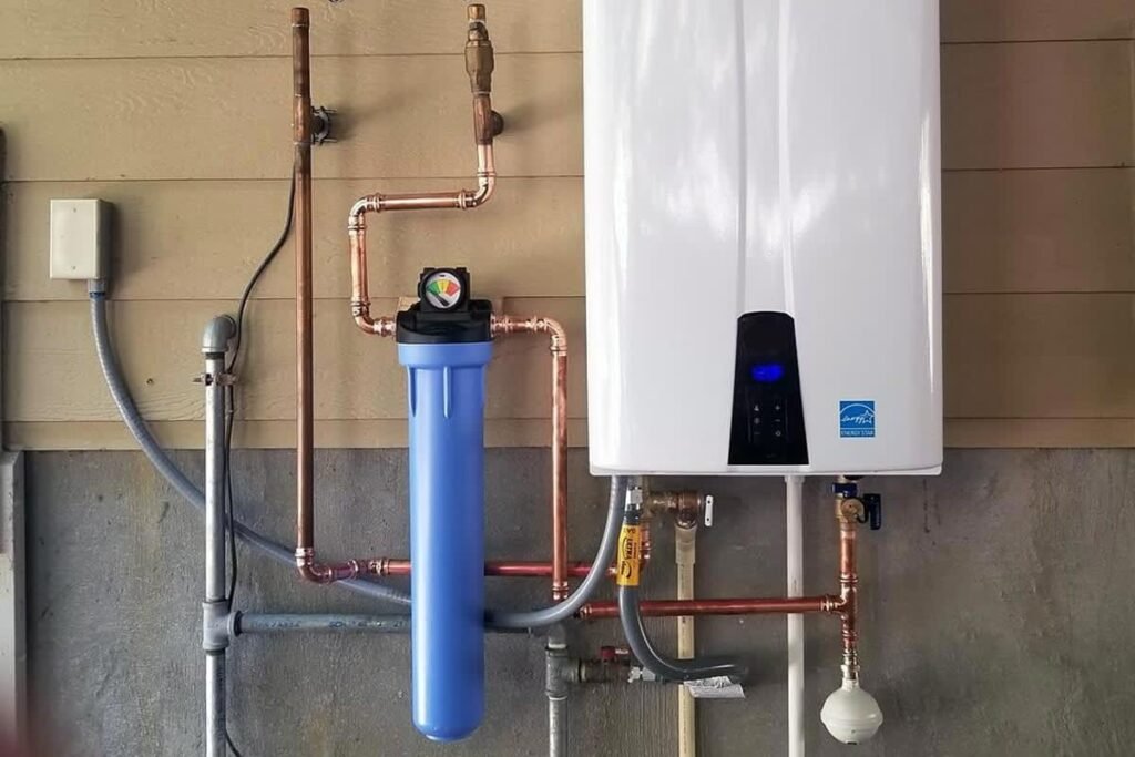 A modern wall-mounted tankless water heater installed in a clean utility room.
