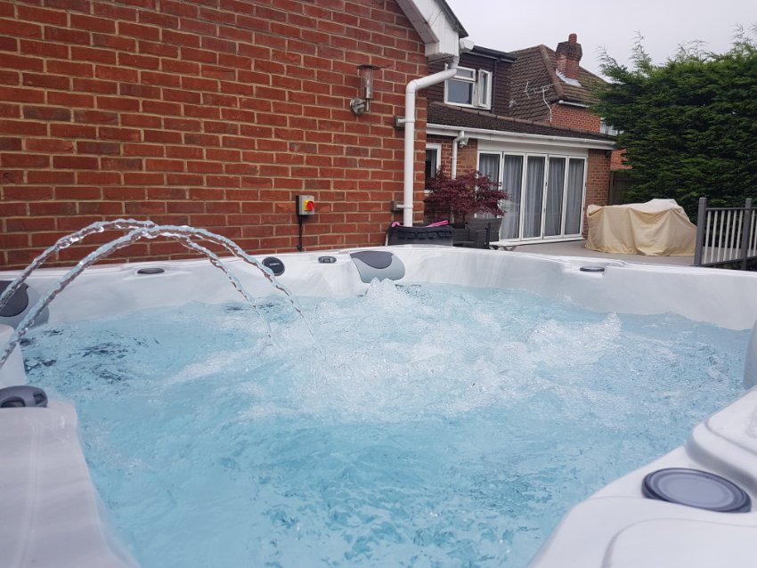 A new hot tub filled with fresh water ready for shocking.