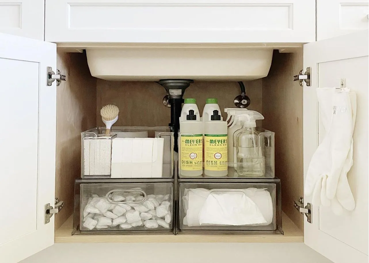 An organized bathroom drawer with labeled bins and grouped toiletries for efficient daily access.
