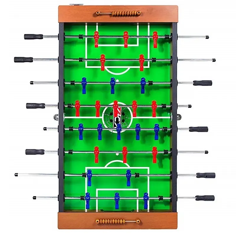 Partial foosball table assembly in a well-lit garage workspace