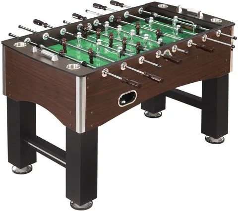 A person measures floor space for a Hathaway foosball table.
