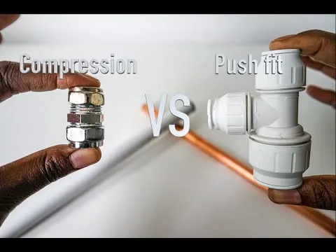 A person using a pipe cutter to square the end of a copper pipe.