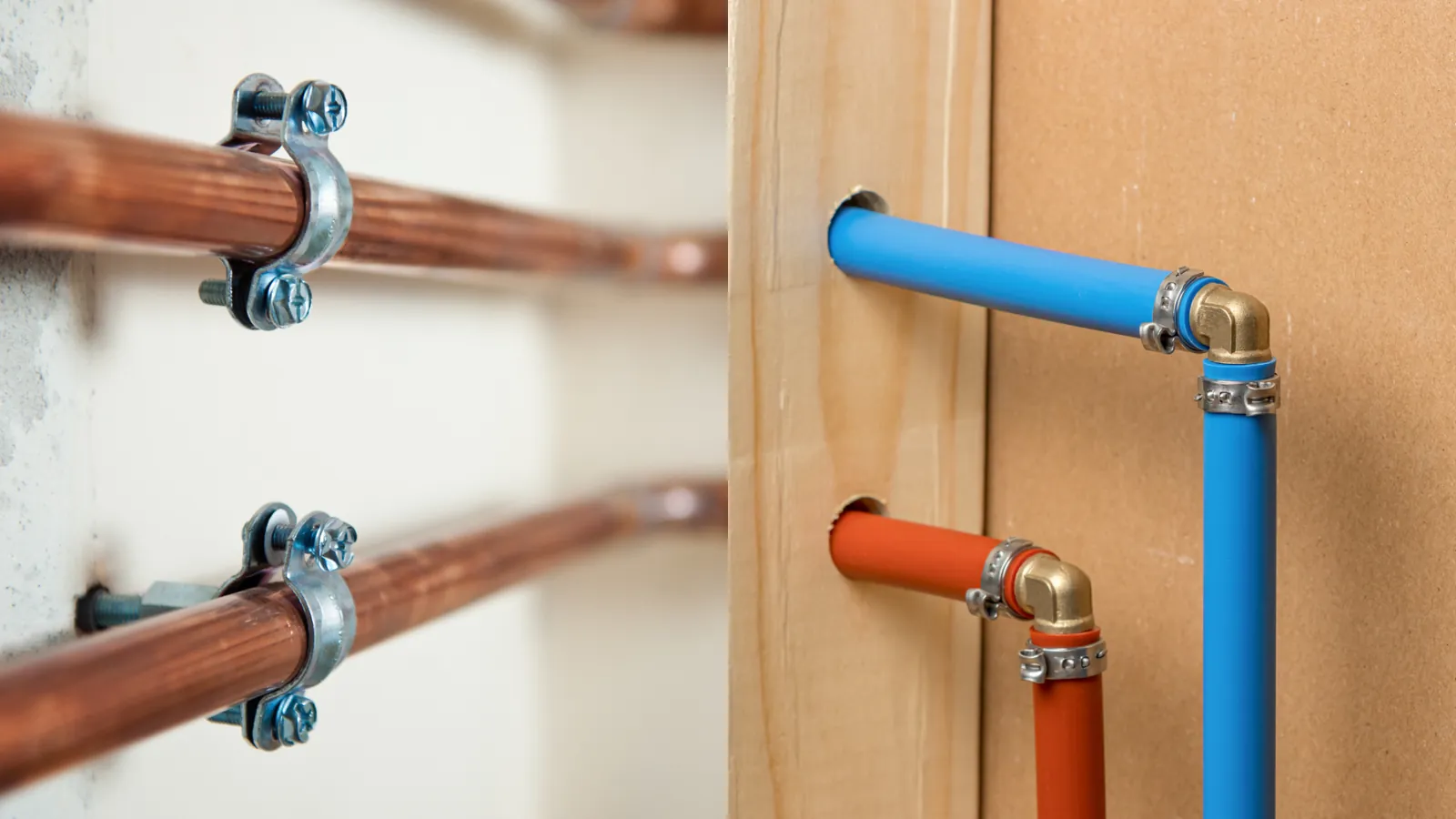 A plumber preparing a copper pipe for soldering using a wire brush.