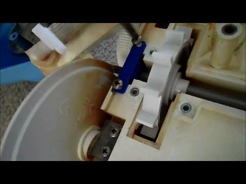 Polaris pool cleaner robot floating above pool floor showing wheel contact issue.