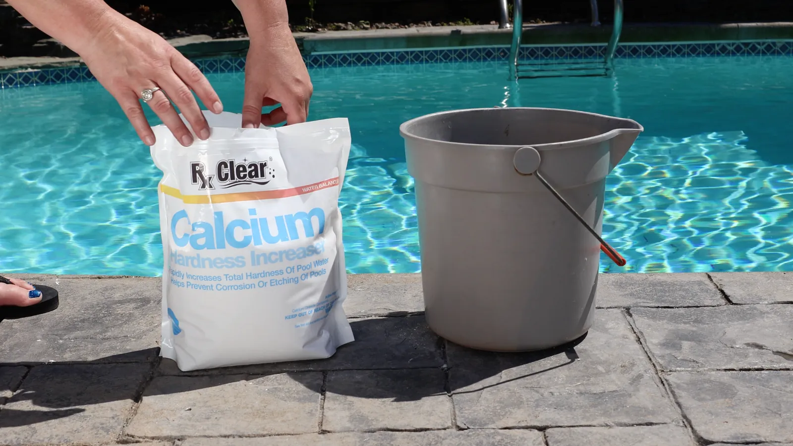 Pool wall showing heavy white scaling and clogged filter media.