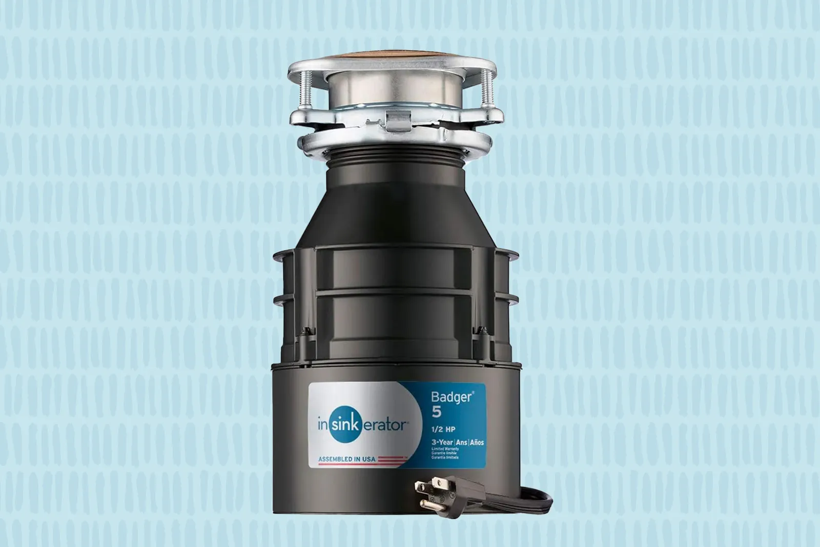 A powerful 3/4 horsepower garbage disposal unit being installed beneath a kitchen sink.