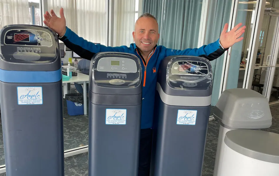 A professional dual-tank water softener system designed for continuous water softening in large homes.