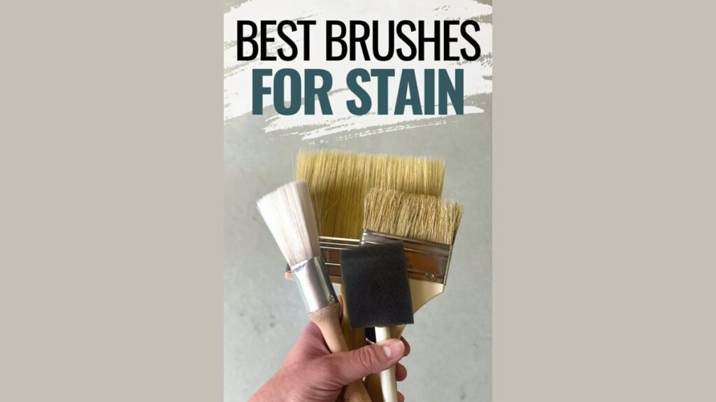 A professional staining brush resting on oak wood to find the best brush for staining wood.