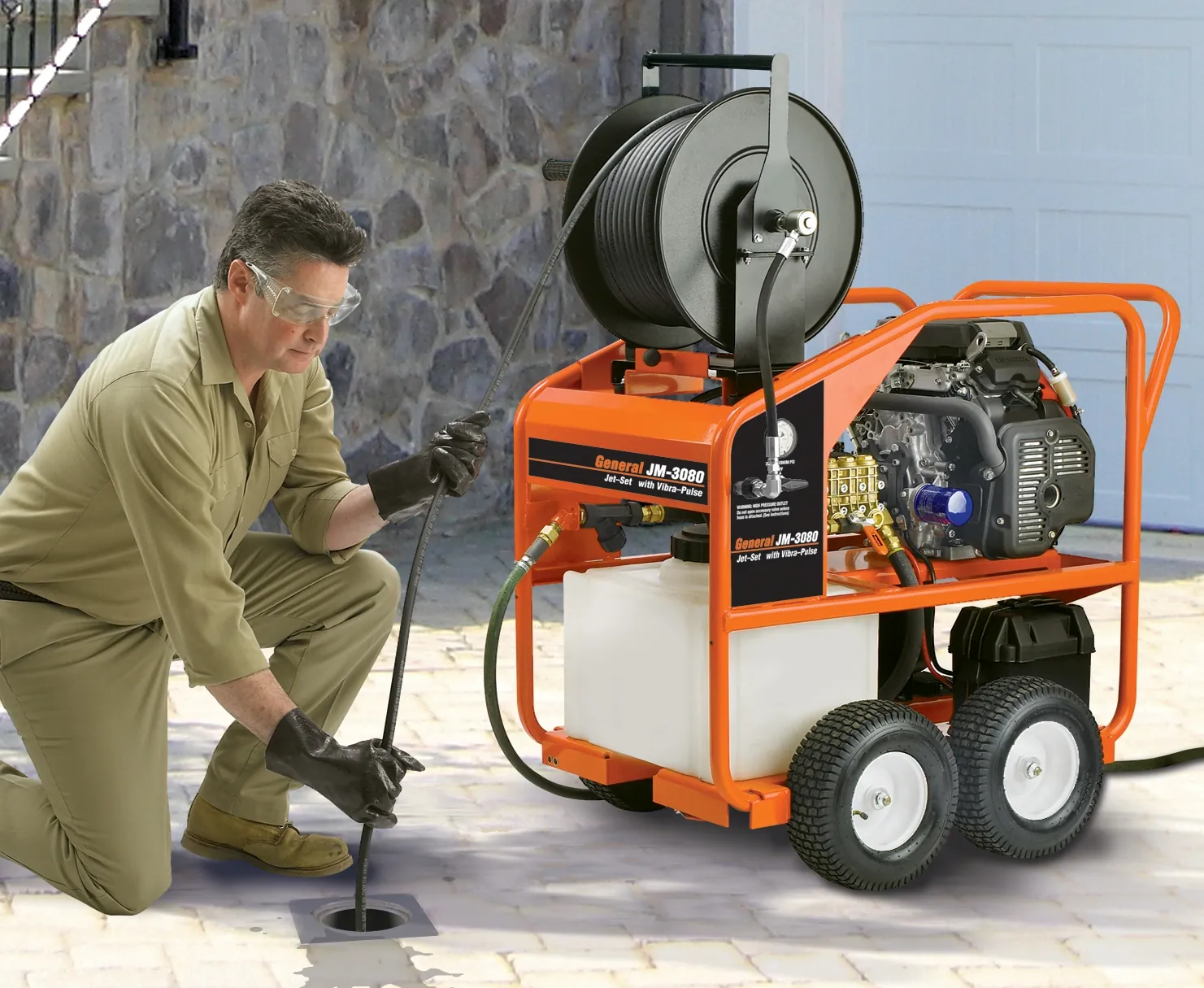 Protective gear and drain cleaning tools prepared for safe home maintenance tasks.