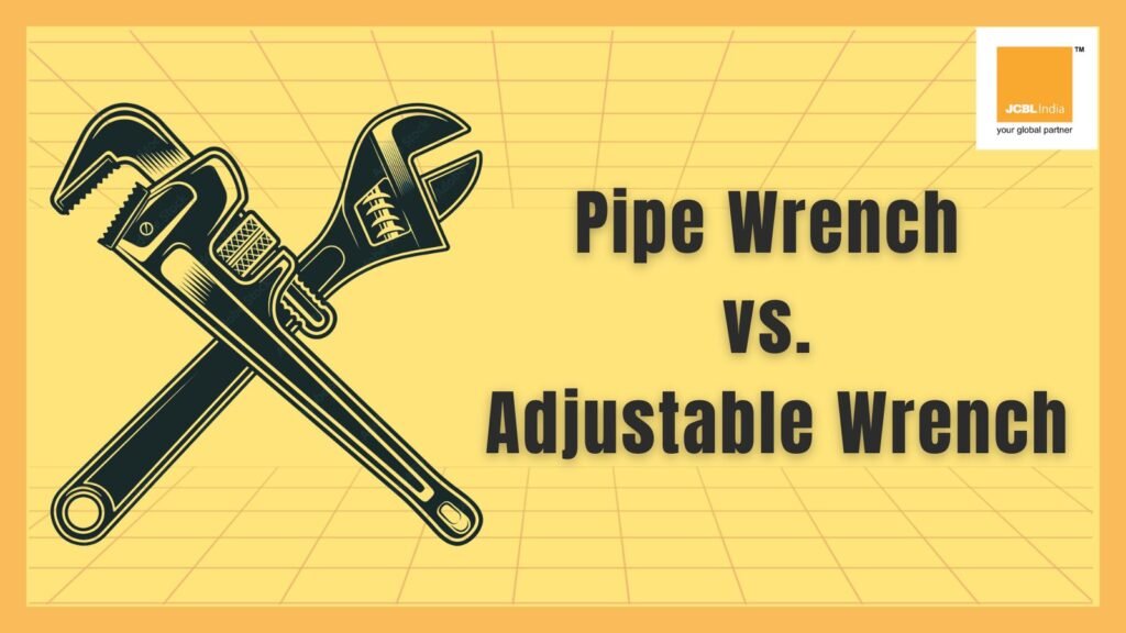 A red pipe wrench and chrome adjustable wrench resting on a wooden workbench.