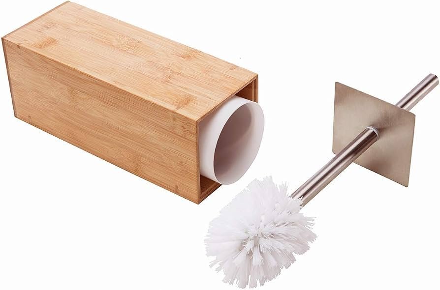 A selection of bamboo and stainless steel bathroom accessories sitting on a marble vanity.