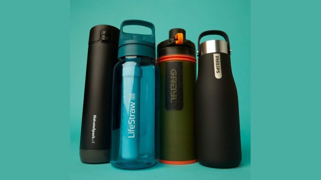 Smart water bottle on marble counter with lemon and mint