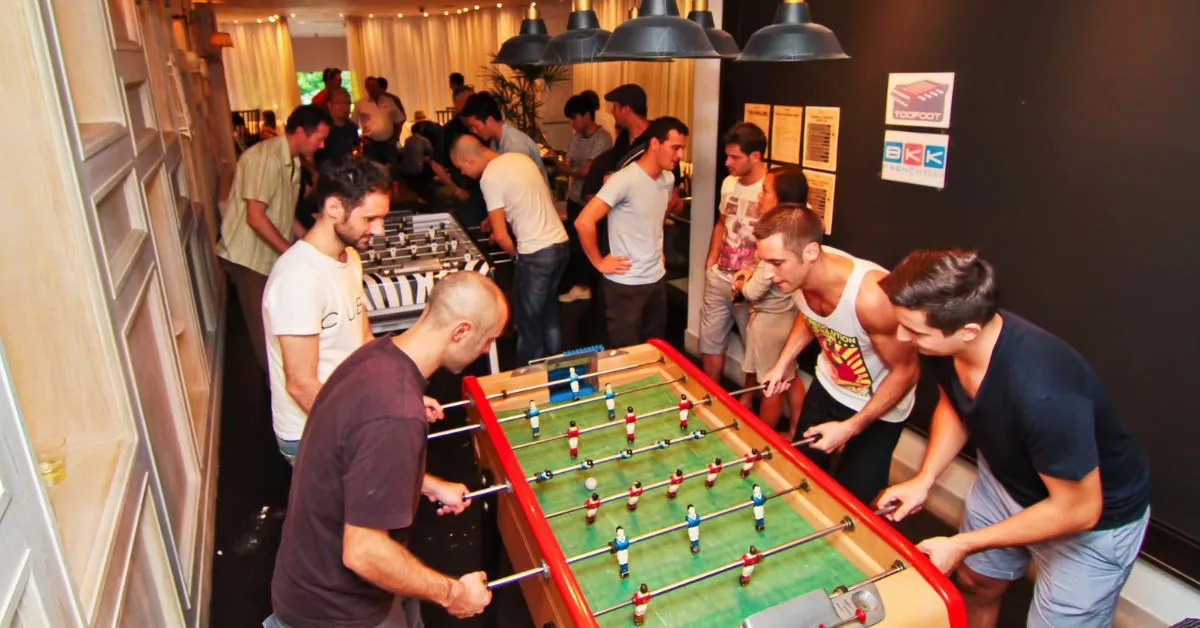 Smartphone and exercise bands on a wooden floor for alternative foosball training