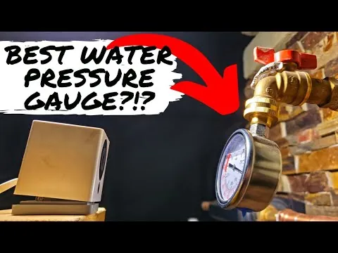 Someone inspecting a water pressure gauge connected to residential piping.