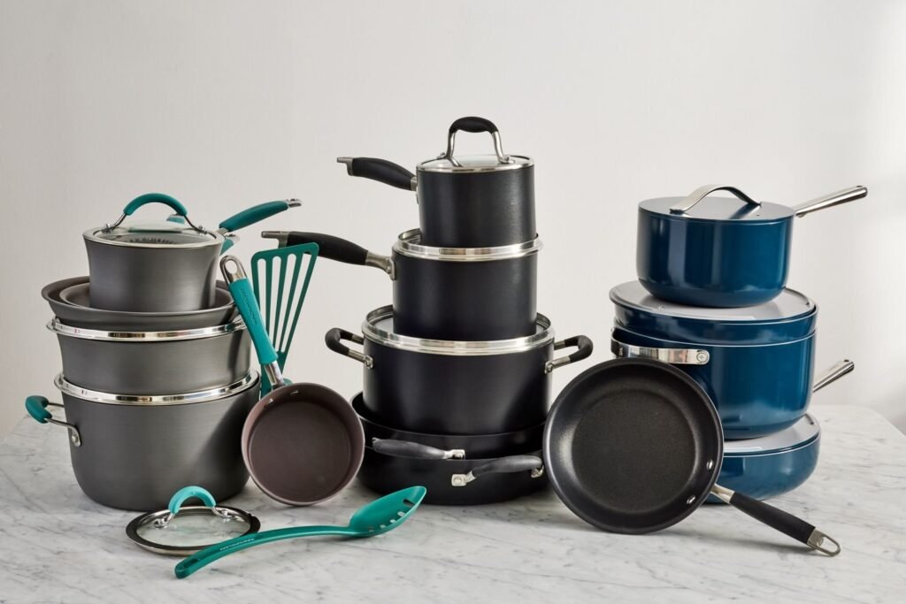 Stack of cheap non stick frying pans on a bright kitchen counter