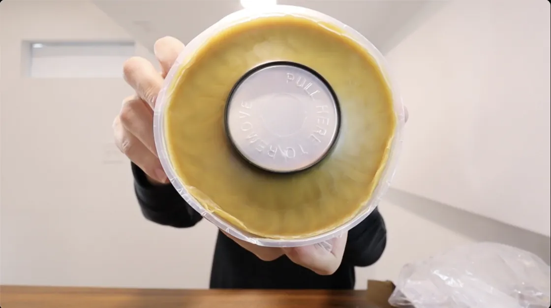 Standard and extra-thick wax rings for toilets displayed side by side on a surface.