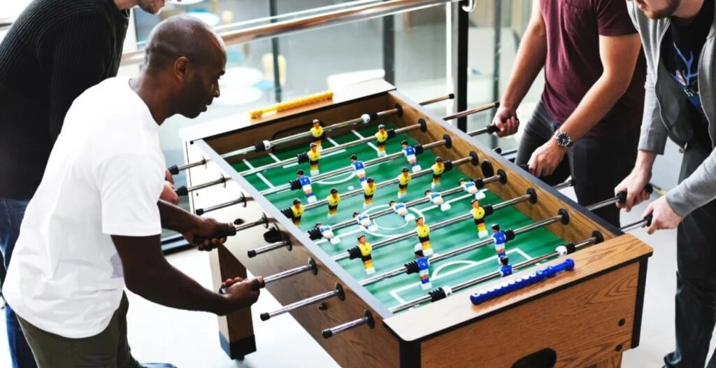 Standard home foosball table in a bright modern living room setting