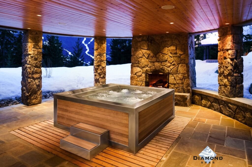 Steam rises from a hot tub being filled by a hose in a snowy winter garden.