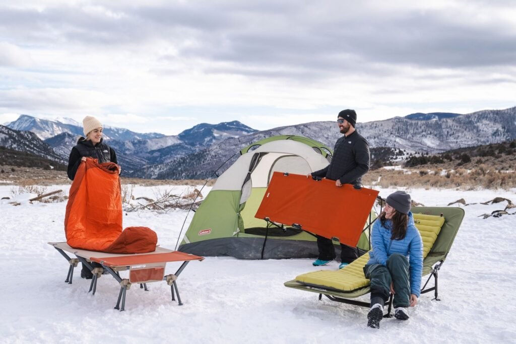 Sturdy camping cot set up inside a well-lit tent for heavy adults