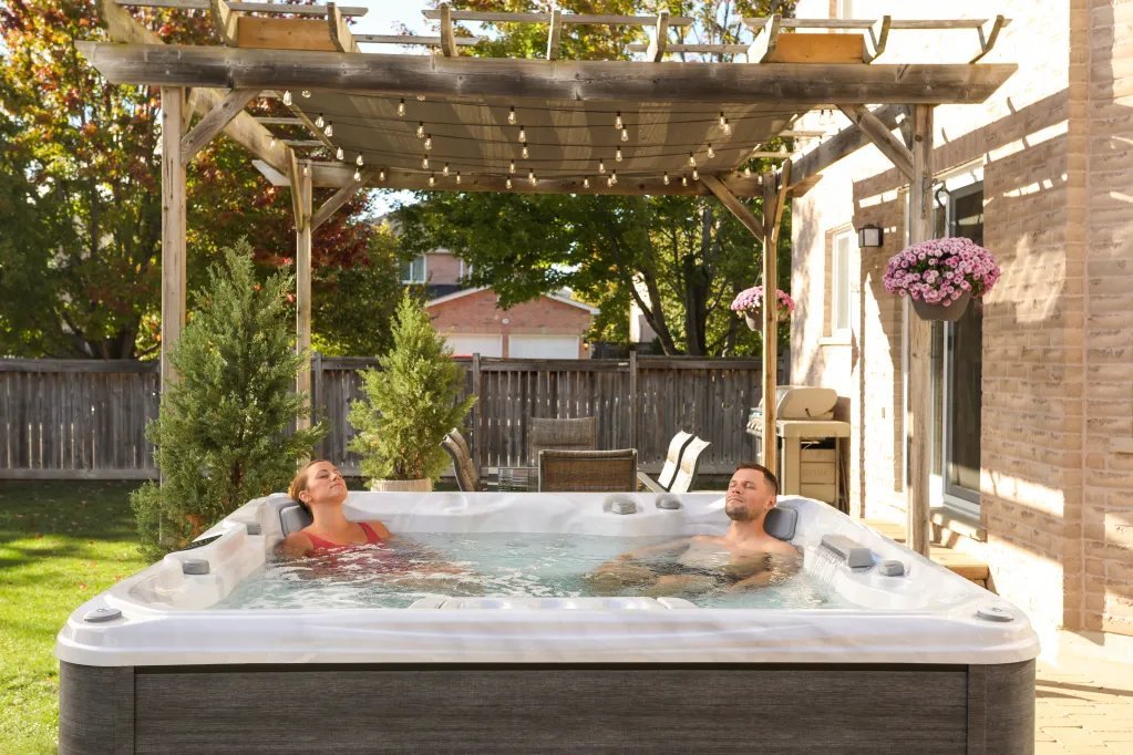 Sundance Spa hot tub in a peaceful backyard setting with natural surroundings
