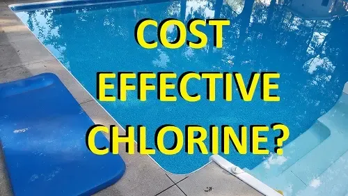 Tablet chlorinator feeder and chlorine tablets resting beside a backyard swimming pool.