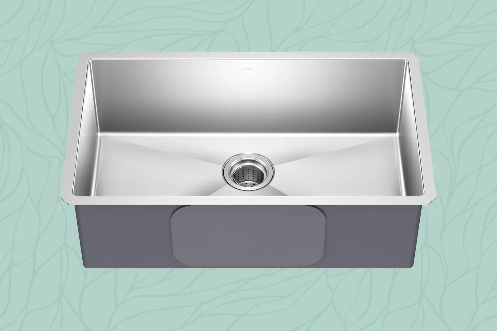 Three different kitchen sink material samples displayed on a clean kitchen countertop.