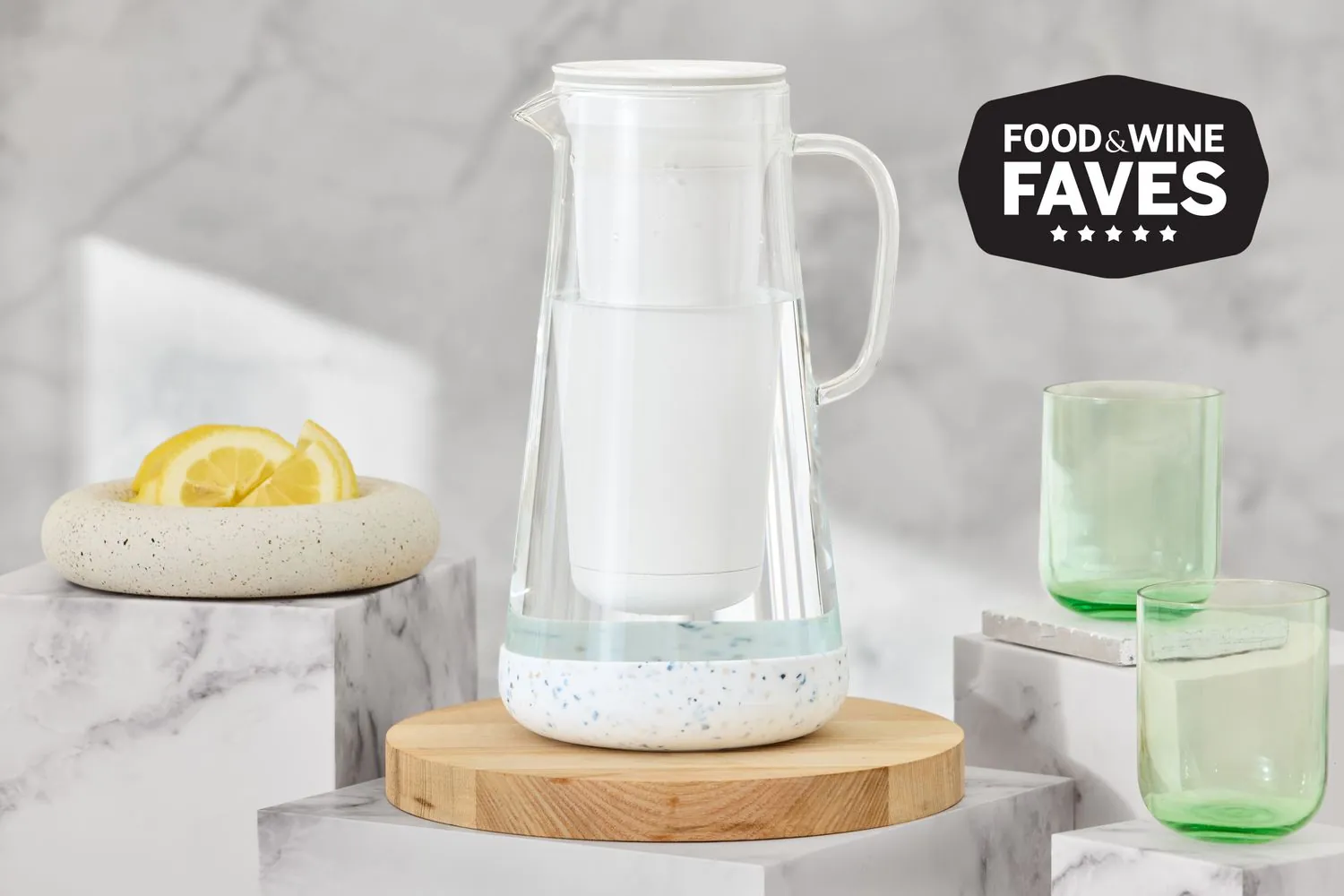 Three popular water filter pitchers lined up for a comparative review on a table.
