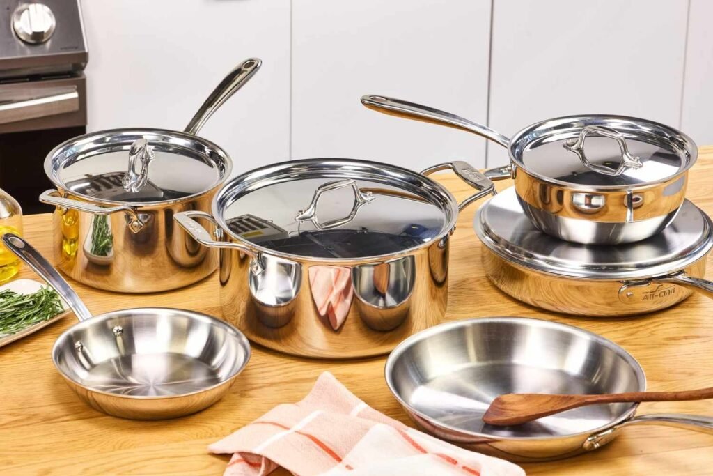 Triple layer stainless steel cookware set on a kitchen counter