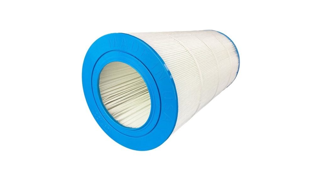 Two replacement pool filter cartridges sitting side by side near a swimming pool.