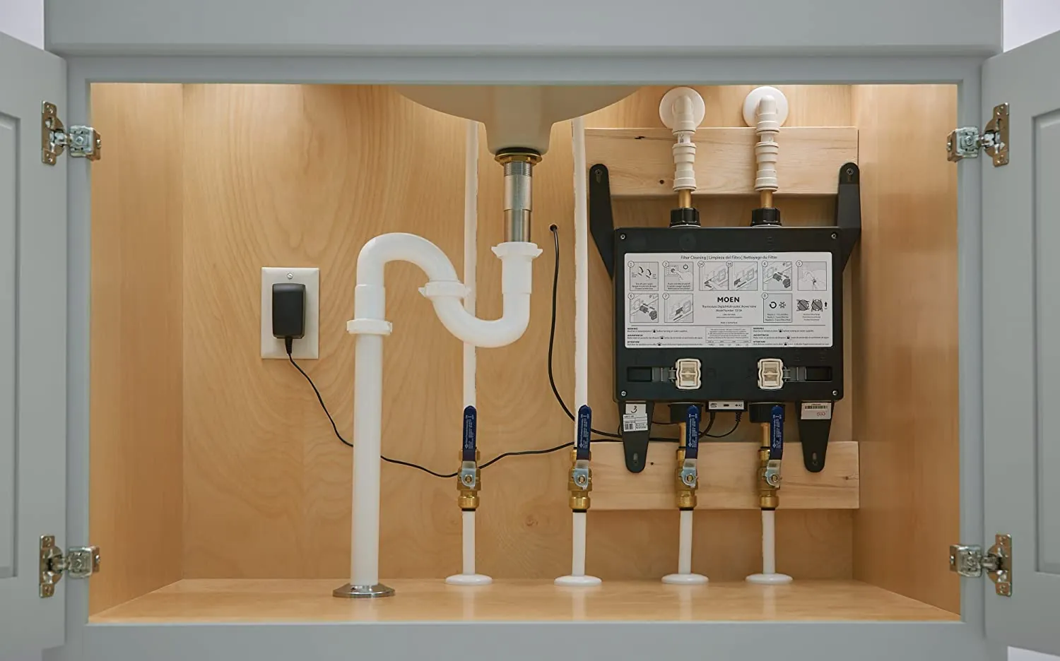 Two types of shower valves displayed side by side on a wall.