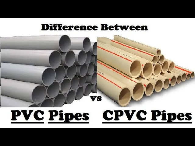 Various plastic pipe fittings neatly organized on a workbench for a plumbing project.
