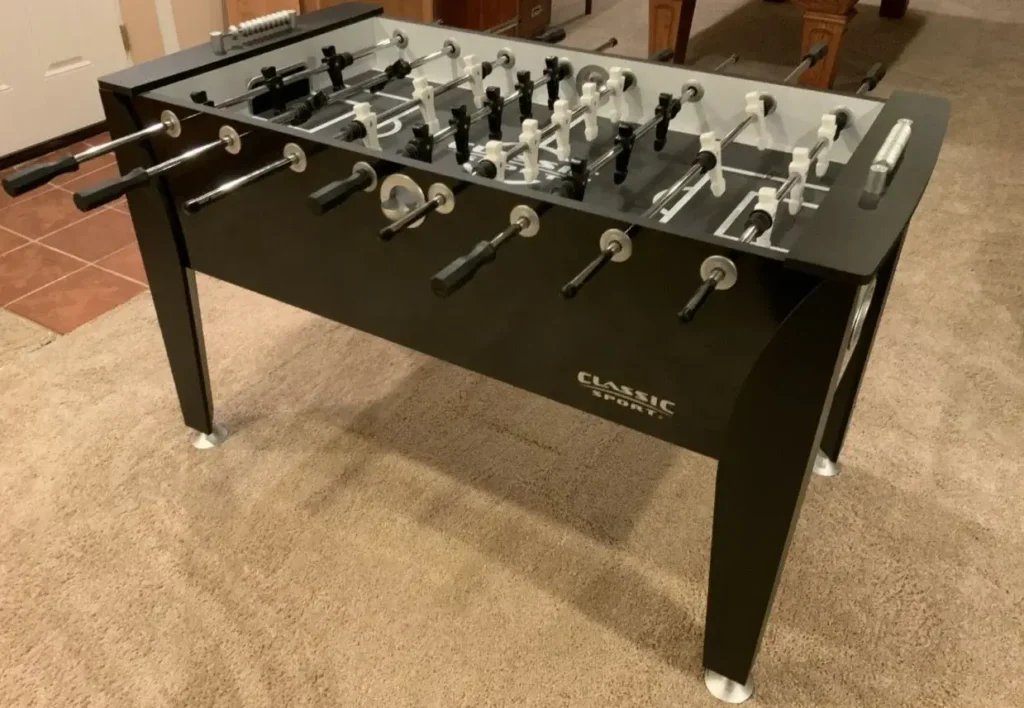 Vintage wooden foosball table in a bright living room