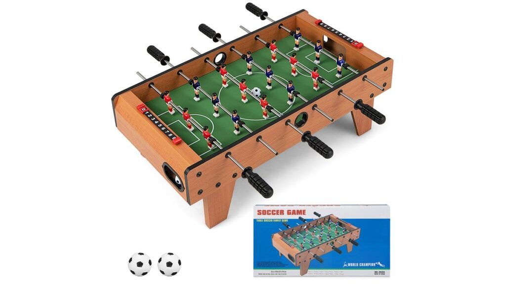 A wooden foosball table sits in a bright modern living room ready for play